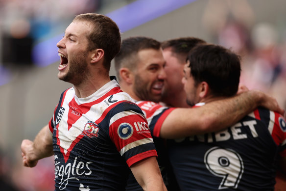 Sam Walker and the Roosters celebrate a try.