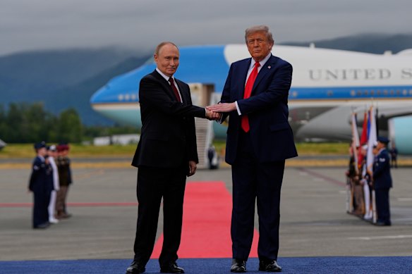 Donald Trump greets Vladimir Putin in Alaska last Friday.