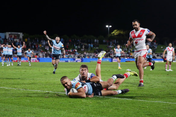 Cronulla’s Will Kennedy crosses for a crucial try against the Dragons.