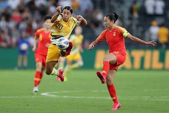 Matildas captain Sam Kerr beats China's Wu Haiyan to the ball during the Olympic qualifer between Australia and China last week.