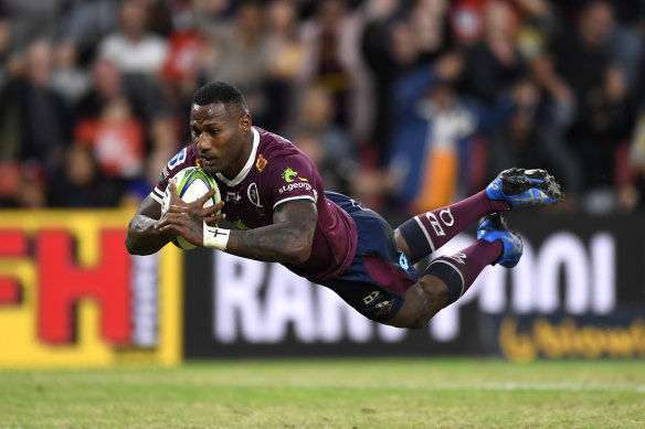 Suliasi Vunivalu scores a try during the round two Super Rugby Trans-Tasman match between the Reds and the Crusaders. 