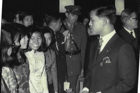 Thailand's Crown Prince talks briefly with a welcoming group of Thai students on his arrival at Sydney Airport in September 1970. 