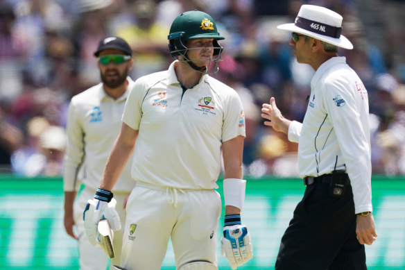 Steve Smith argues over a dead-ball decision after being struck by a couple of bouncers.