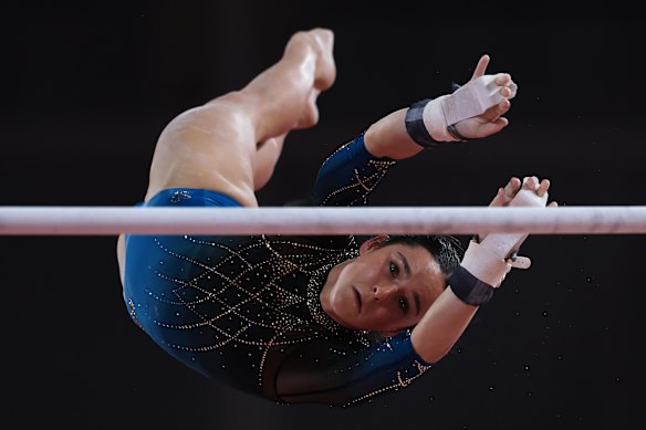 Kate McDonald competes on the uneven bars during the all-around team final.