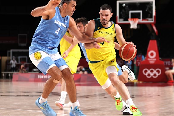Australia’s Chris Goulding drives to the basket against Luis Scola.