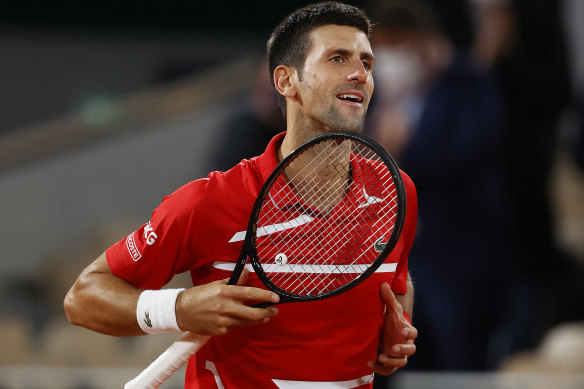Novak Djokovic celebrates after his gruelling French Open semi-final victory over Stefanos Tsitsipas.