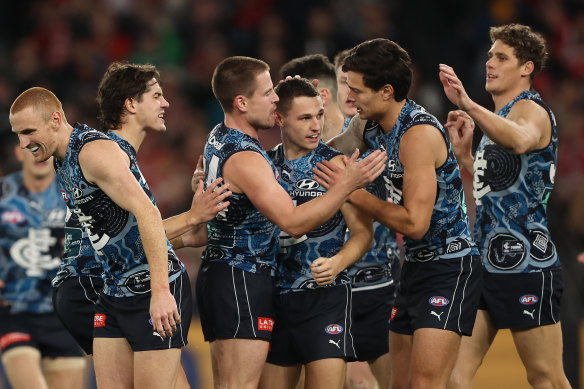 Carlton celebrates a goal in their side’s win over Sydney.