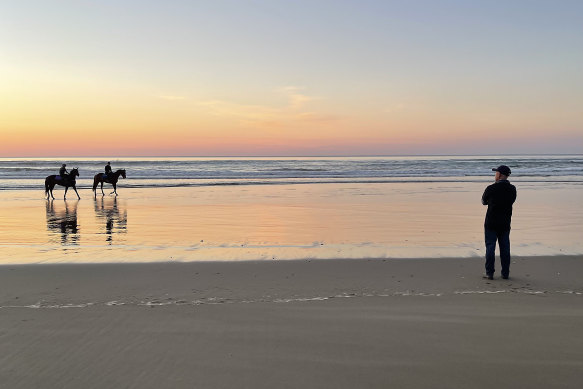 Terry Robinson cuts a lonely figure as  a frustrated watcher as Art Cadeau finishes his work at Seven Mile Beach.