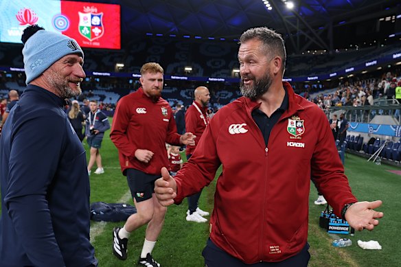 Wet one … Andy Farrell, right, talks to Waratahs assistant coach Mike Catt after the match.