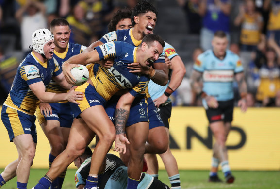 Reagan Campbell-Gillard and teammates celebrate the front-rower’s try on Saturday night. 