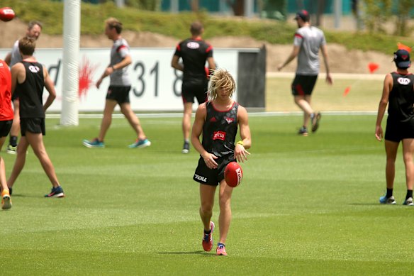 Essendon players, including Dyson Heppell (foreground), train on January 11, 2016, the day before their suspensions were announced.