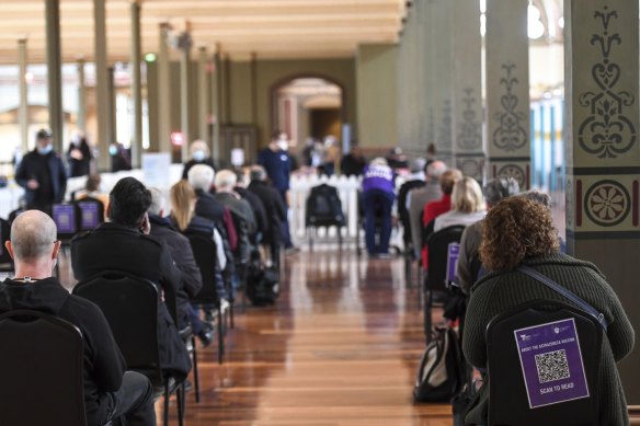 Inside the mass vaccination site, dozens of Victorians were patiently waiting for their dose, reading the newspaper or idly flicking through their phones. Doctors hovered around, consulting people under 39.