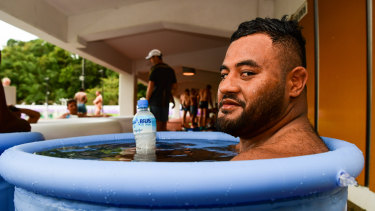 Taniela Tupou sits in an ice bath after Wallabies training in Odawara. 