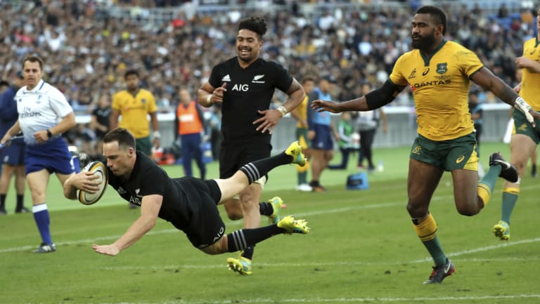 Runaway: New Zealand's Ben Smith scores the All Blacks fourth try against the Wallabies.