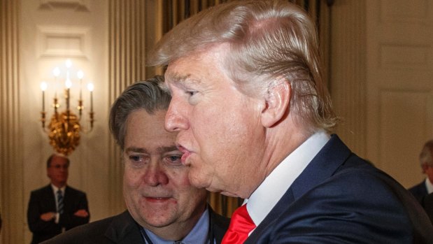 US President Donald Trump and then-White House chief strategist Steve Bannon in the State Dining Room of the White House in Washington in February. 