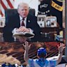 A person worships as a recorded video message from President Donald Trump plays at Rededicate 250.