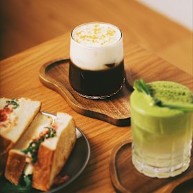 Pandan iced matcha and the “Fansipan drink” with sweetened cold brew, Mont Blanc cream and ground roasted rice.