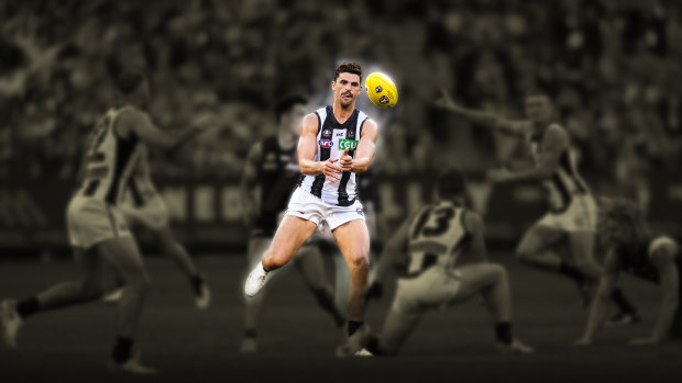 Scott Pendlebury disposes of the ball in a game against Essendon in 2019.
