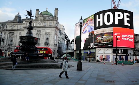An advert shows the word 'Hope' at an unusually quiet Piccadilly Circus on Jan 6.