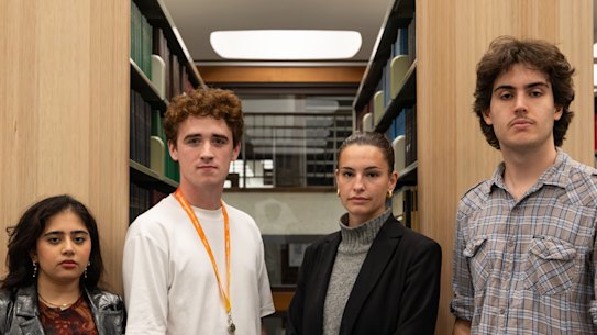 Students Esha Serai, Remus Brasier, Zoe Wilkinson and Monash Student Association president Leroy Van Schellebeck in the law library.