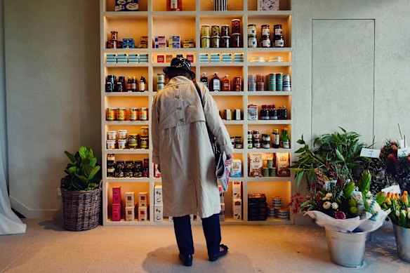 A shopper peruses the produce at Breadcetera.