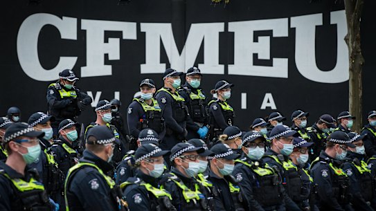 Police outside the CFMEU’s office last month.