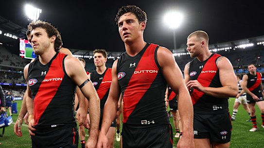 Dejected Essendon players after the club’s loss to Geelong.