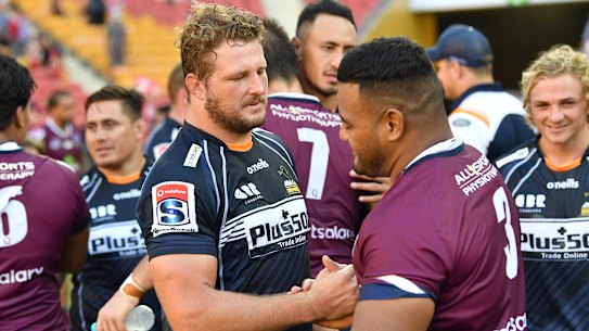 James Slipper shaking hands with former Reds teammate Taniela Tupou.