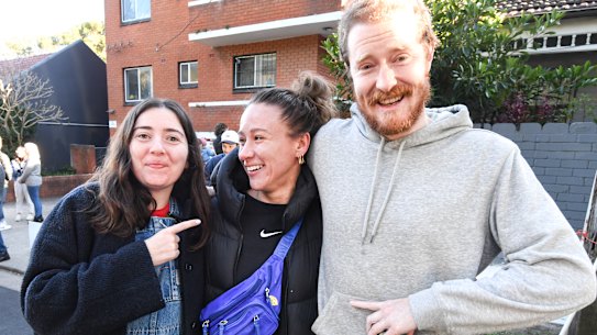 Happy buyer ( center) Millie congratulated by friends after the auction.
