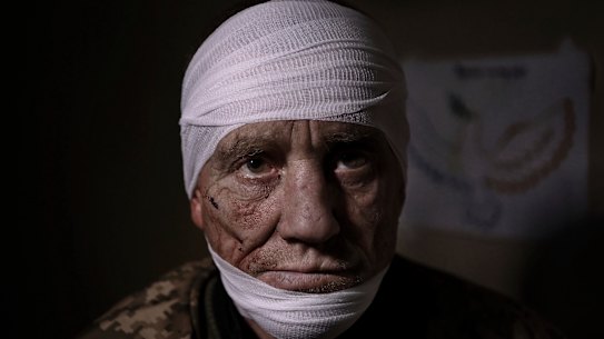 At a medical stabilisation point in Bakhmut, Ukrainian soldier Oleh Nazarov, 51, has sustained head, neck and back injuries from a grenade attack in his trench.