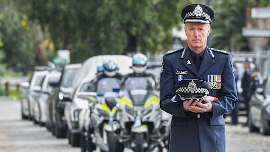 Deputy Commissioner of Victoria Police Rick Nugent with Constable Glen Humphris’ police hat.