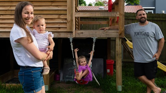 Nick Cooper and Heidi Cooper with their children Lucy (pink dress) and Mila. Nick contracted COVID-19, he was isolating with his family but only passed it on to his daughter Lucy. Seaforth, February 10, 2022. Photo: Rhett Wyman/SMH