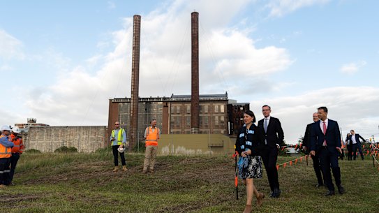 Premier Gladys Berejiklian, Treasurer Dominic Perrottet and Transport Minister Andrew Constance in front of the heritage listed White Bay Power Station.