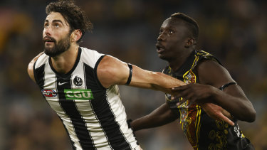 Ex-Richmond tall Mabior Chol, pictured here going head to head with Collingwood star Brodie Grundy, will boost Gold Coast’s ruck department.