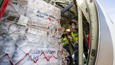 Humanitarian supplies are loaded on a C-130J Hercules aircraft bound for Tonga, at the RAAF base in Amberley. 