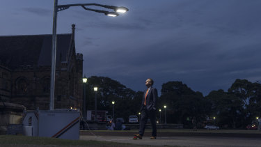 Thomas Maschmeyer, professor of chemistry at the University of Sydney, activates lamps on his campus powered by his new Gelion battery.
