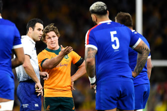 Michael Hooper and referee Ben O’Keeffe.