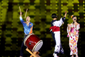Entertainers perform a traditional song at the closing ceremony of the Tokyo Games.