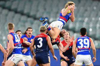 Cody Weightman soars over Max Gawn earlier this year.