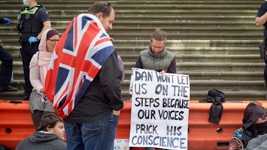Photo of people protesting against the Pandemic Bill outside the Victorian Parliament on Thursday.