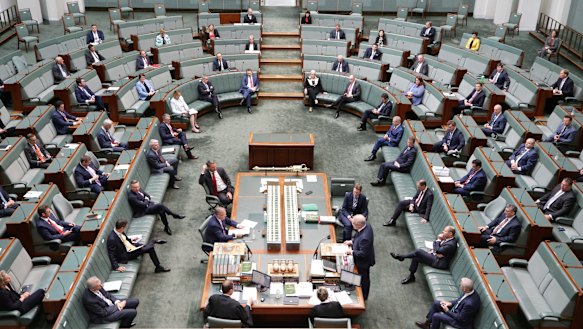 MPs observing social distancing when Parliament sat in March.