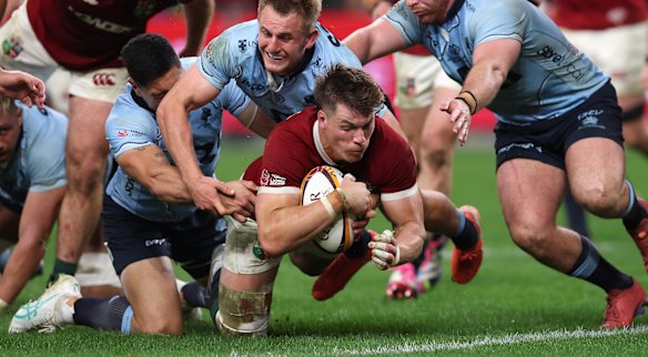 Huw Jones scores one of his two tries.