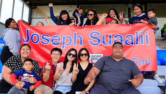 Entourage ... Joseph Suaalii’s friends and family, including uncle Amani (front right).