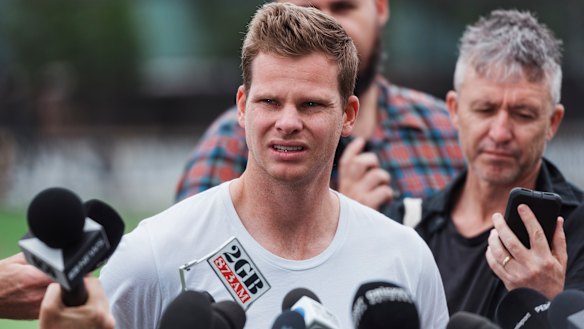 Hold the phone: Steve Smith talks to the press in Sydney on Friday.