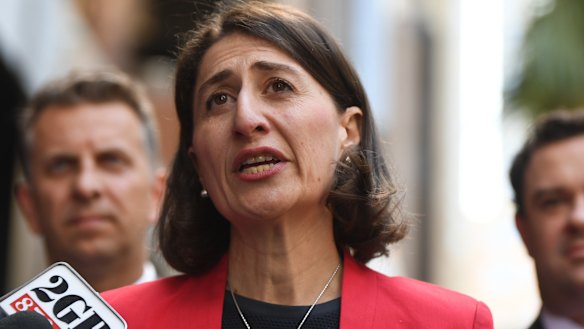 Backflip: Premier Gladys Berejiklian is flanked by Stuart Ayres and  Andrew Constance while announcing the change in policy. 