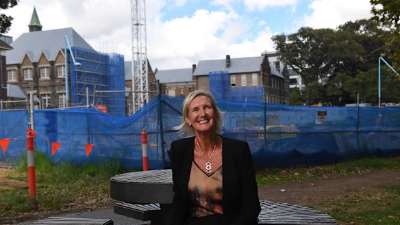 Principal of the new Inner Sydney High School, Robyn Matthews, with the school being built in the background.