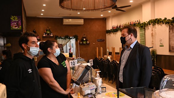 Federal MP Jason Falinski (right) pictured with Forest Brunch Bar owners Stephen and Frances Armatas.