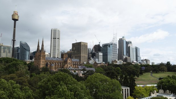 The apartment has three balconies and city skyline views. 