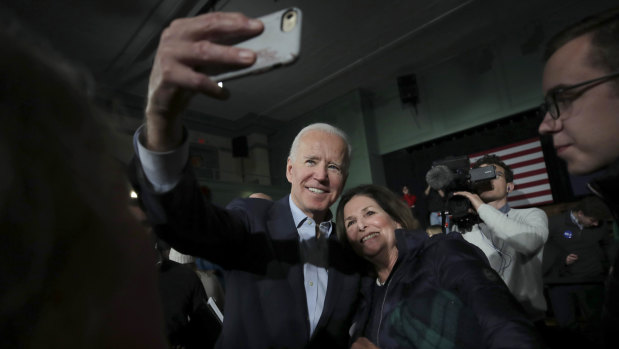 Democratic US presidential candidate and former vice-president Joe Biden smiles as he takes a selfie during a campaign stop in Exeter.