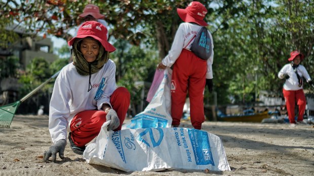 Wayan Sarta and 14 colleagues were first funded by Coca Cola a decade ago to clean the beach daily.